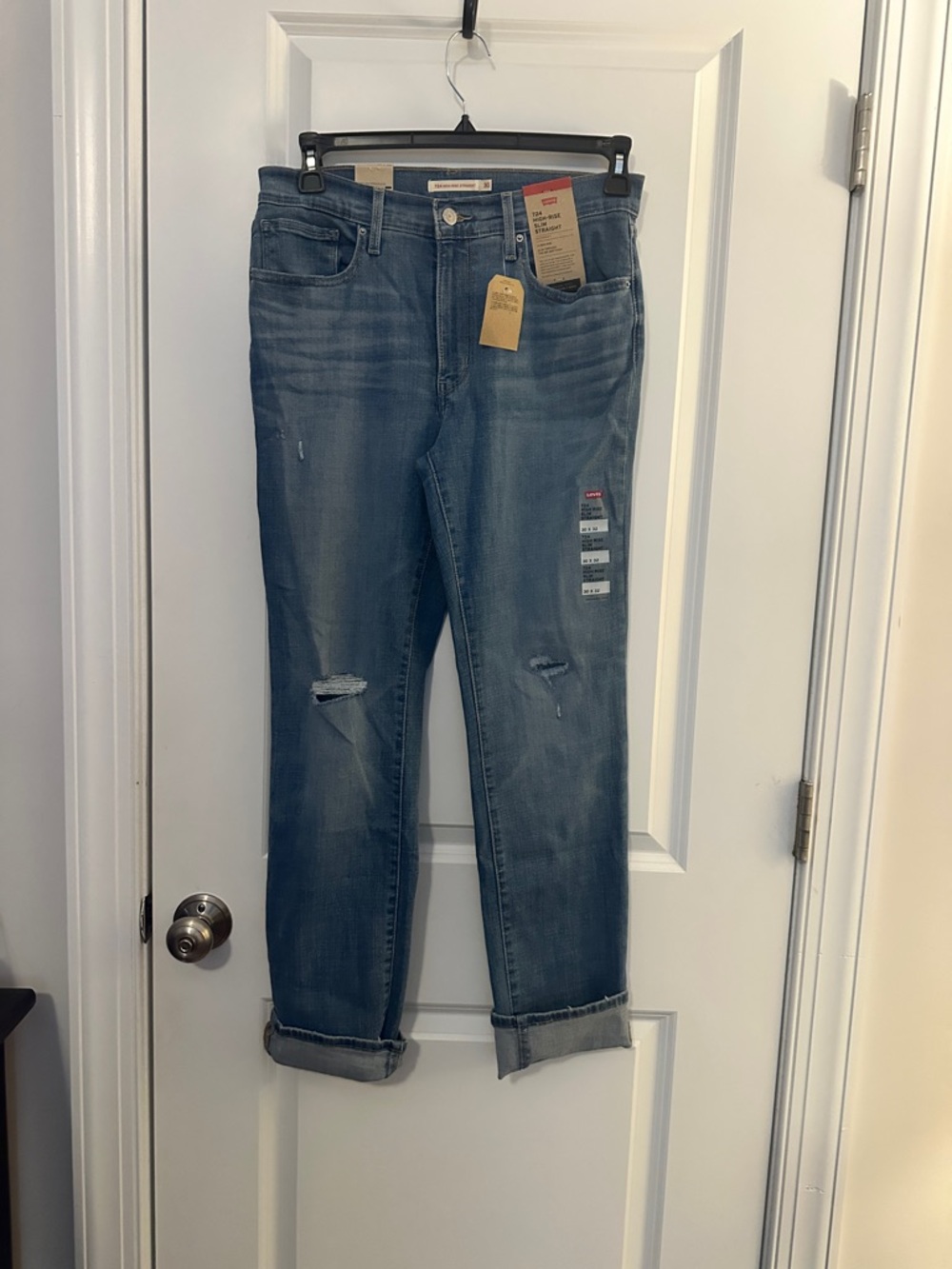 Levi's Women's Light Blue Straight-Leg Jeans with Knee Distressing High waisted